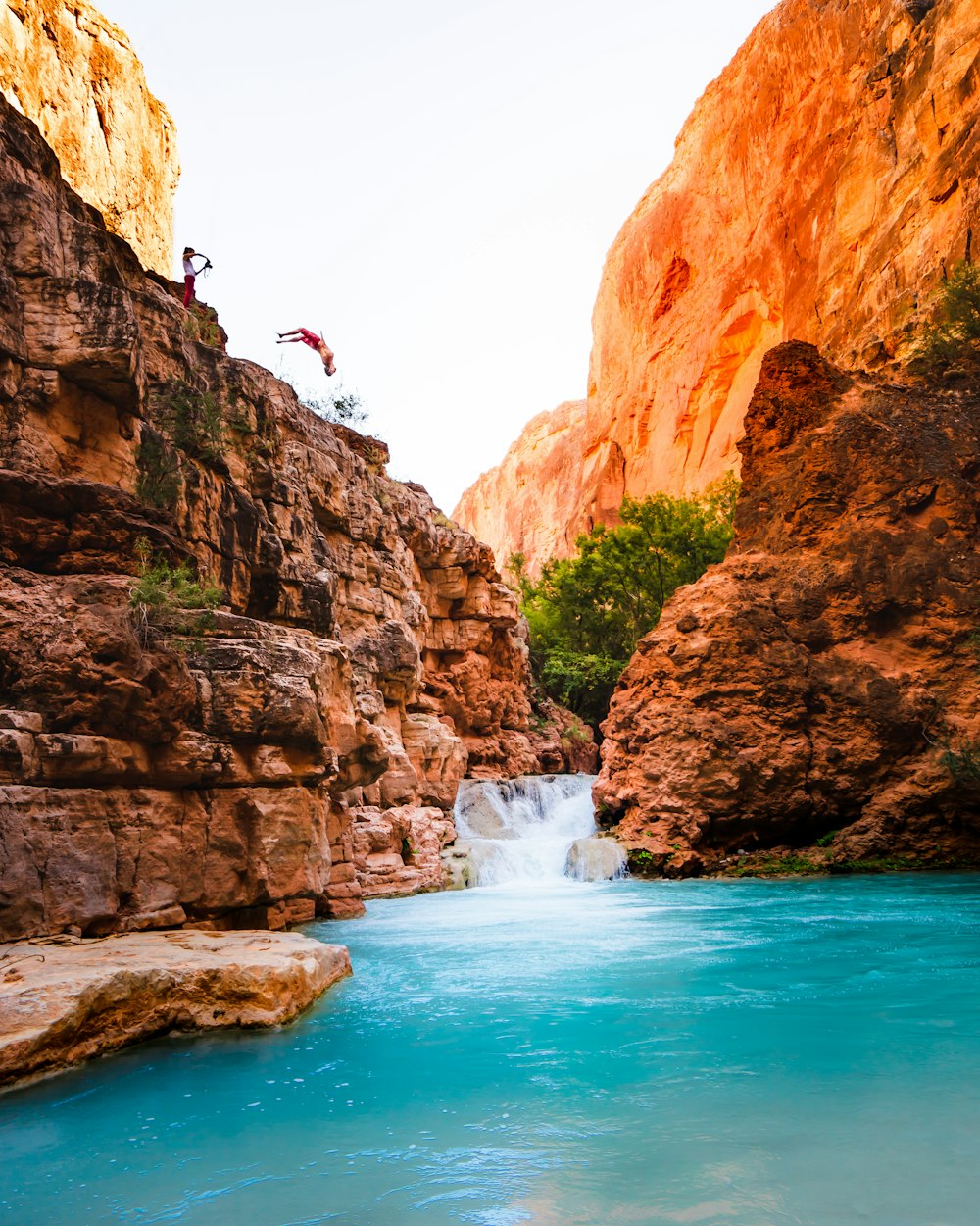 man jumping into river