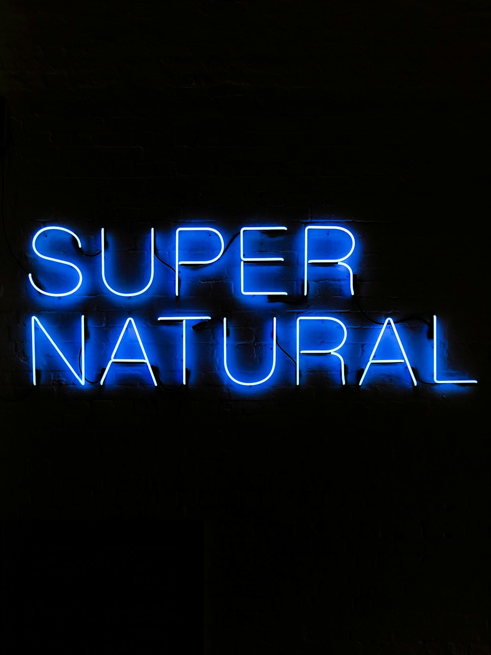 blue supernatural neon signage