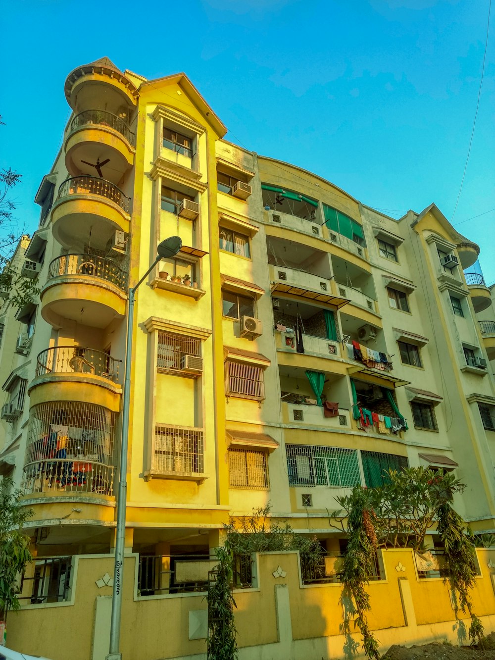 white and beige condominium building during nighttime