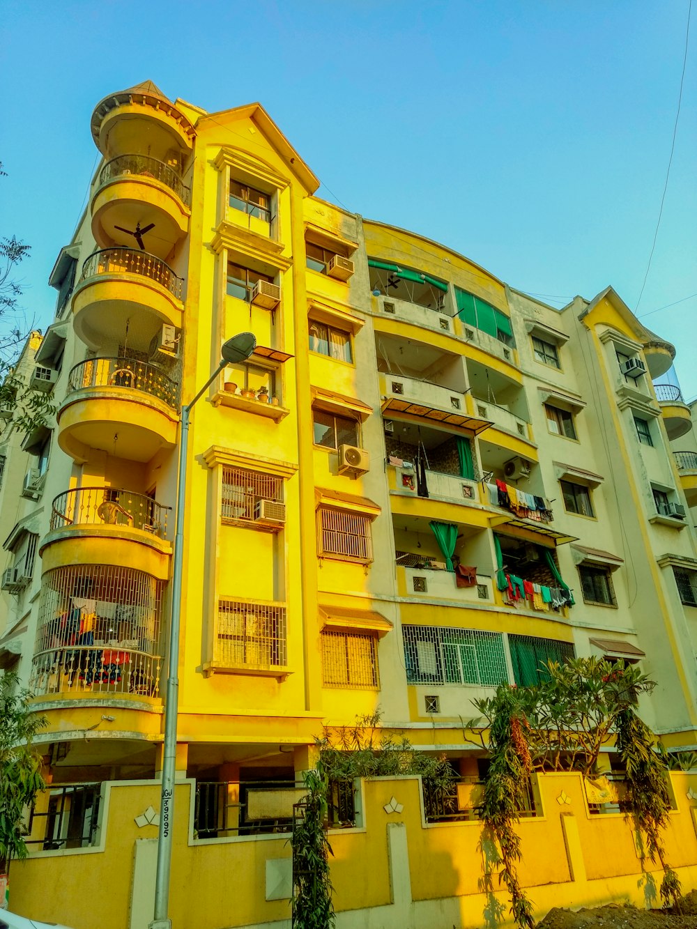 yellow and green concrete high-rise building