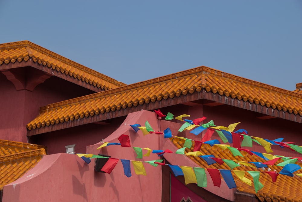 assorted-color buntings ties on roof of building under gray skies