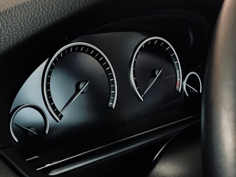 black vehicle instrument cluster panel