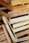 A collection of stacked, unfinished wooden crates with visible textures and grain patterns.