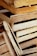 A collection of stacked, unfinished wooden crates with visible textures and grain patterns.