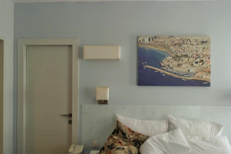 A sleek foldable bed neatly tucked against a wall in a bright, compact apartment.