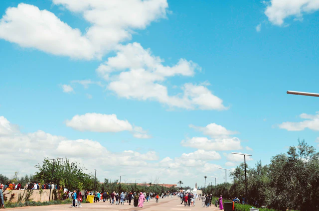 A vibrant street scene in Manus Province with locals engaging in daily activities under clear blue skies.