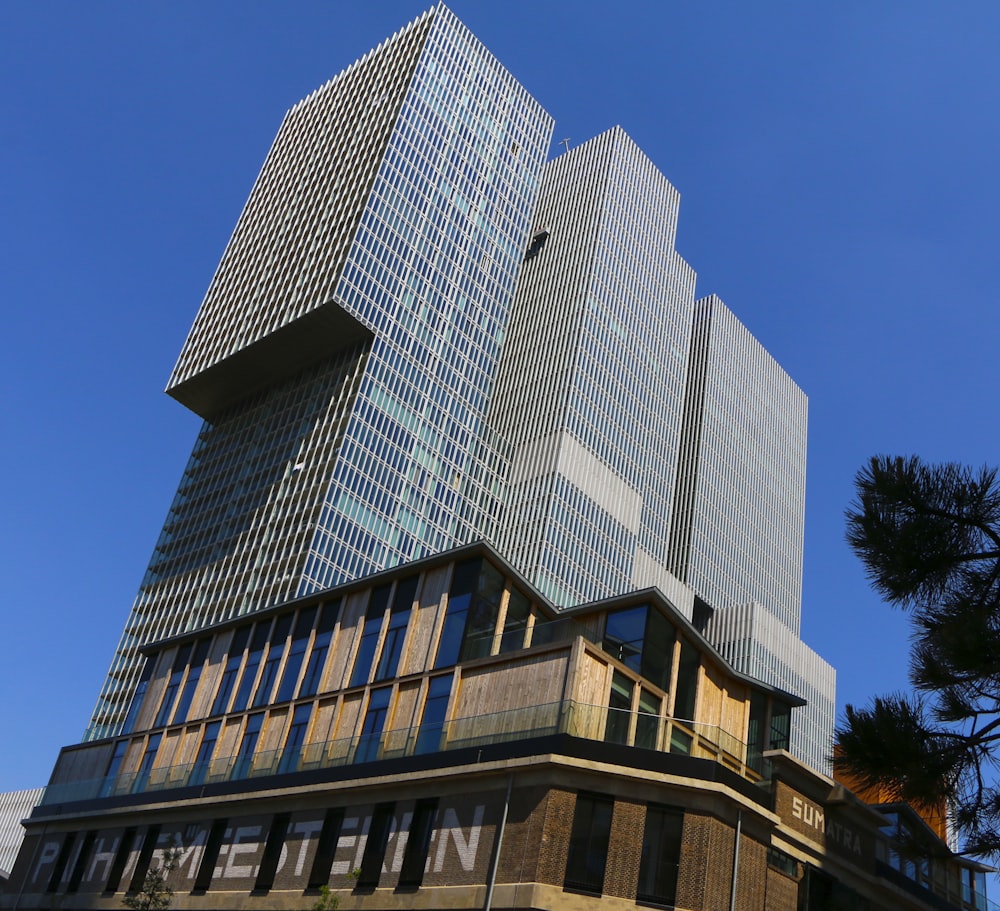 low angle photography of building under blue sky