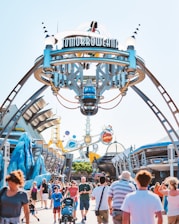 A cheerful family entering a Disney park at sunrise, ready for a day of fun.