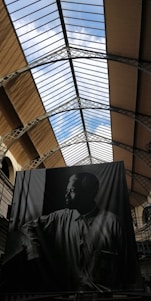 Portrait of a thoughtful business leader reflecting in a minimalist office space.