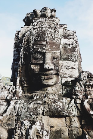 brown stone face formation during daytime