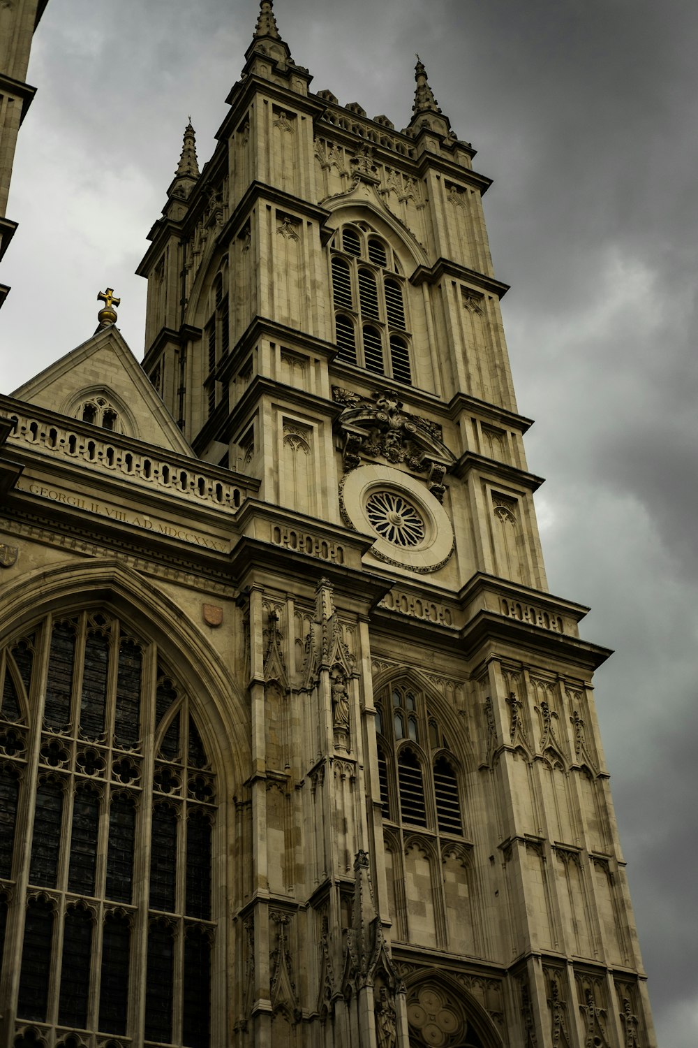 brown cathedral under gloomy sky