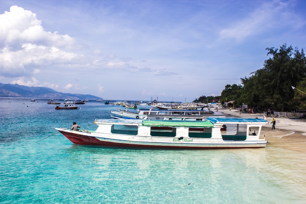 white boat on body of water