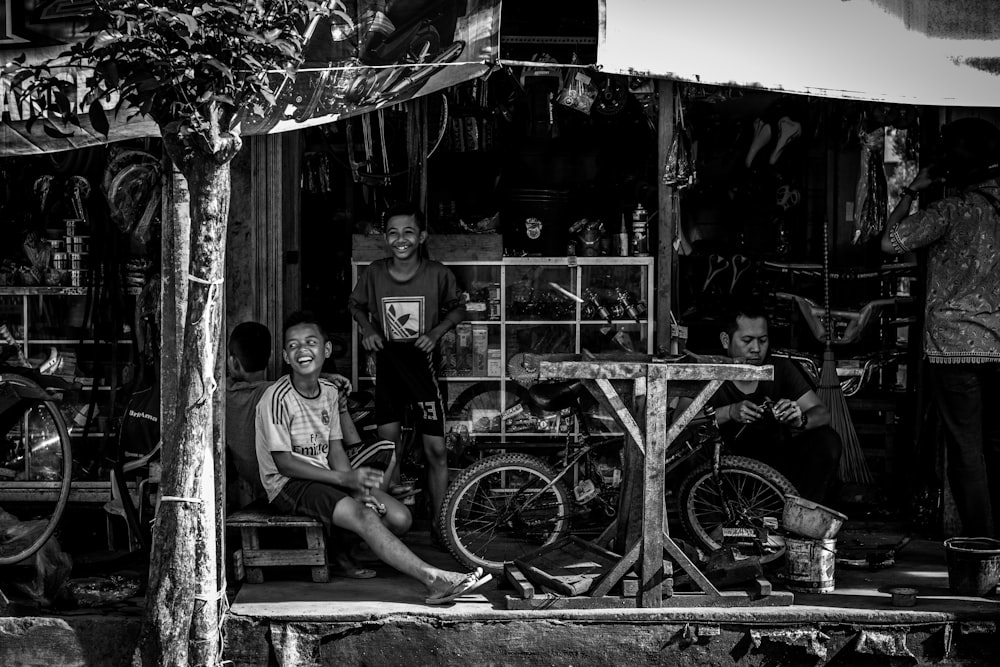 man sitting beside bike