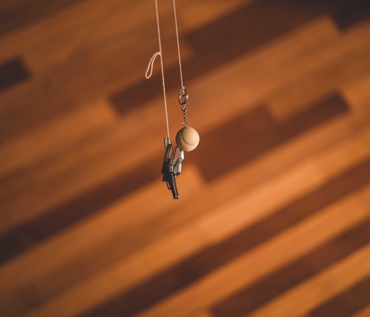 Selection of custom engraved wooden keychains neatly arranged on a white background