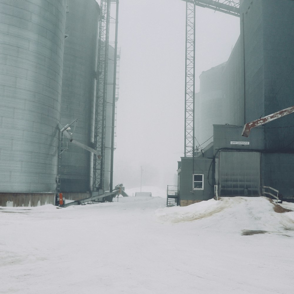 gray metal silos during winter