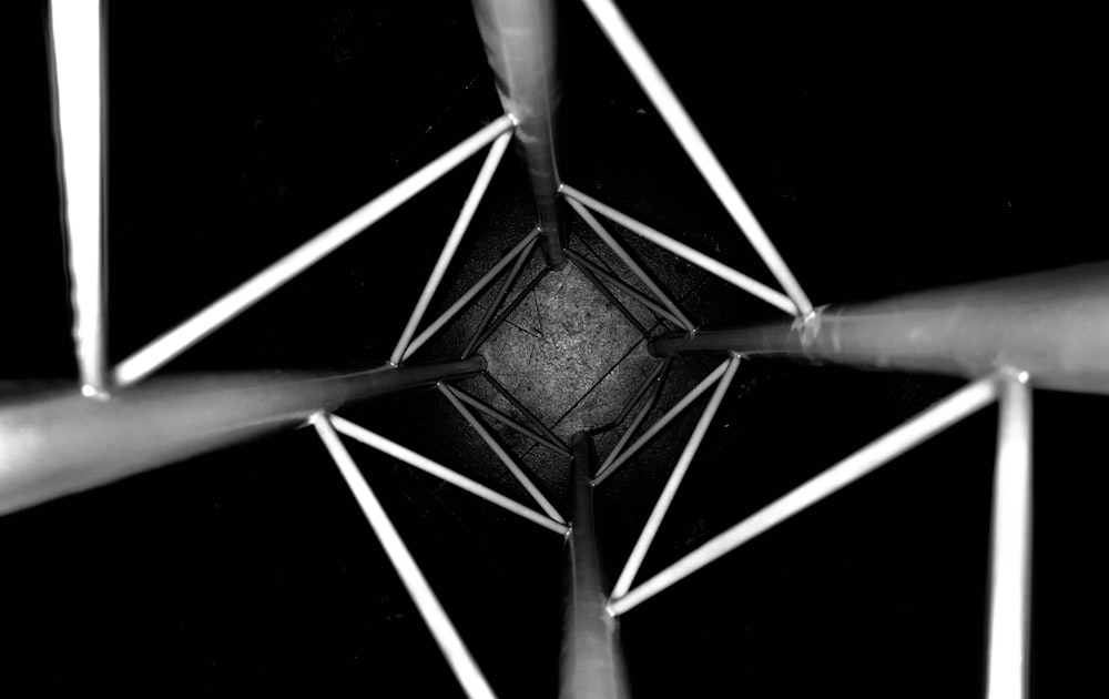 a black and white photo of a metal structure