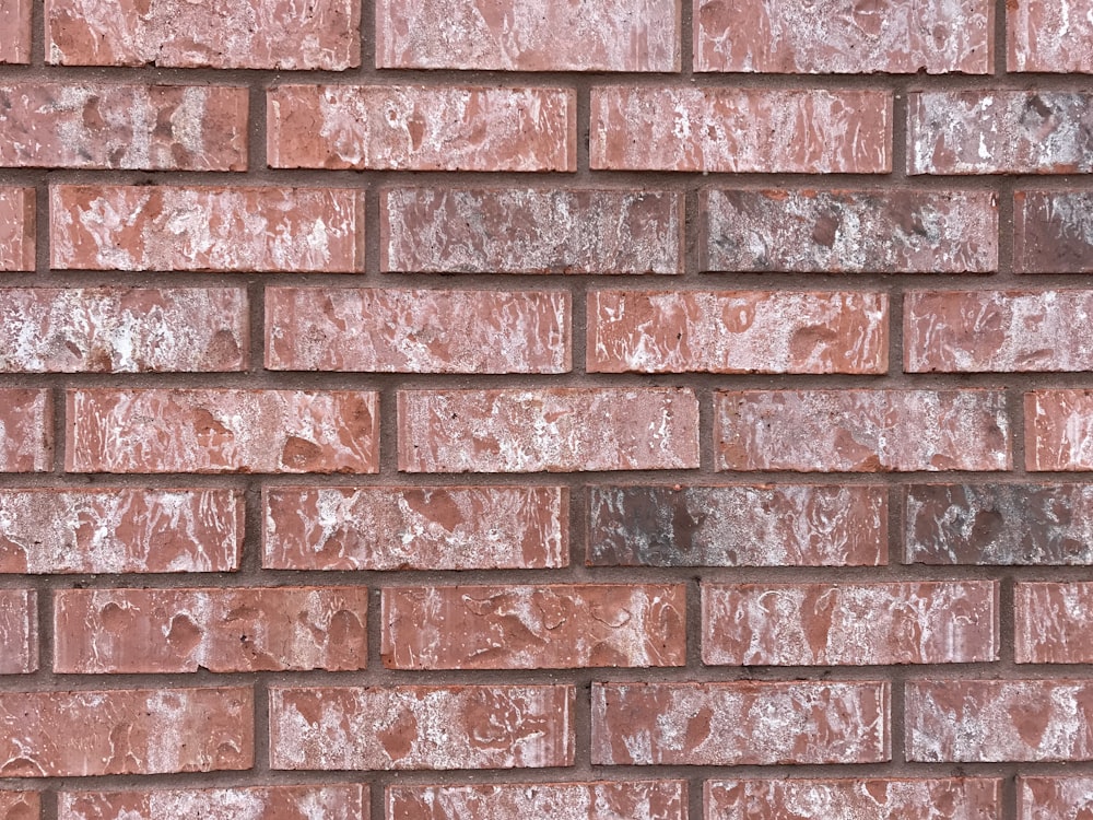 closed-up photography of brown brick wall