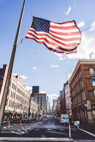 waving flag of United States of America during daytime