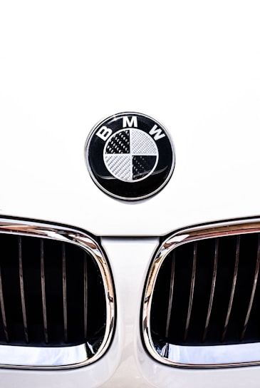 close-up photography of white BMW vehicle