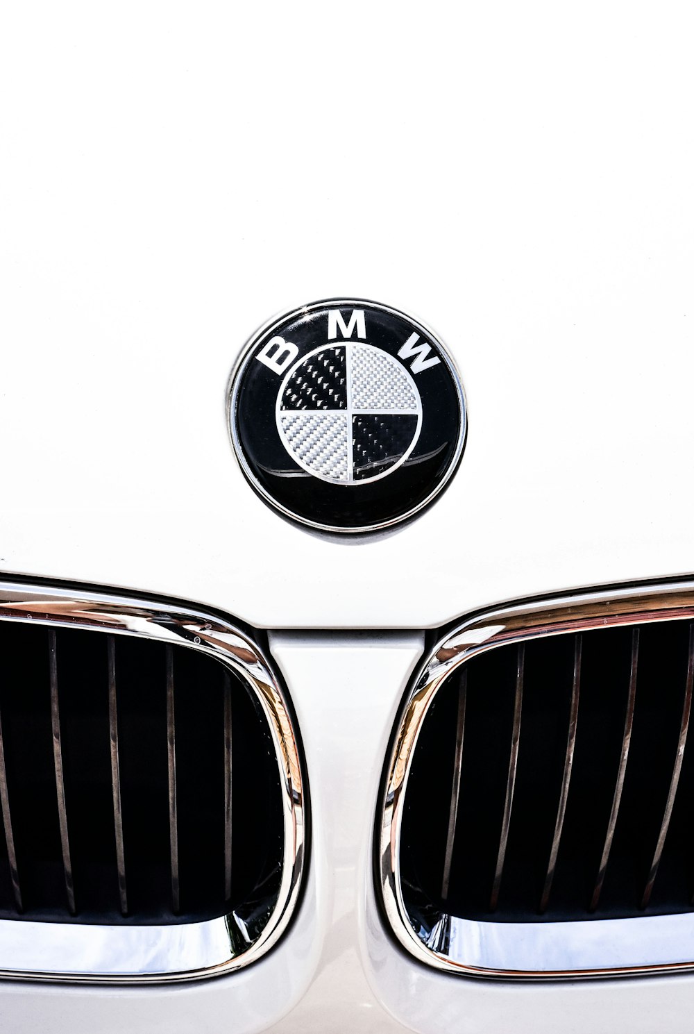 close-up photography of white BMW vehicle