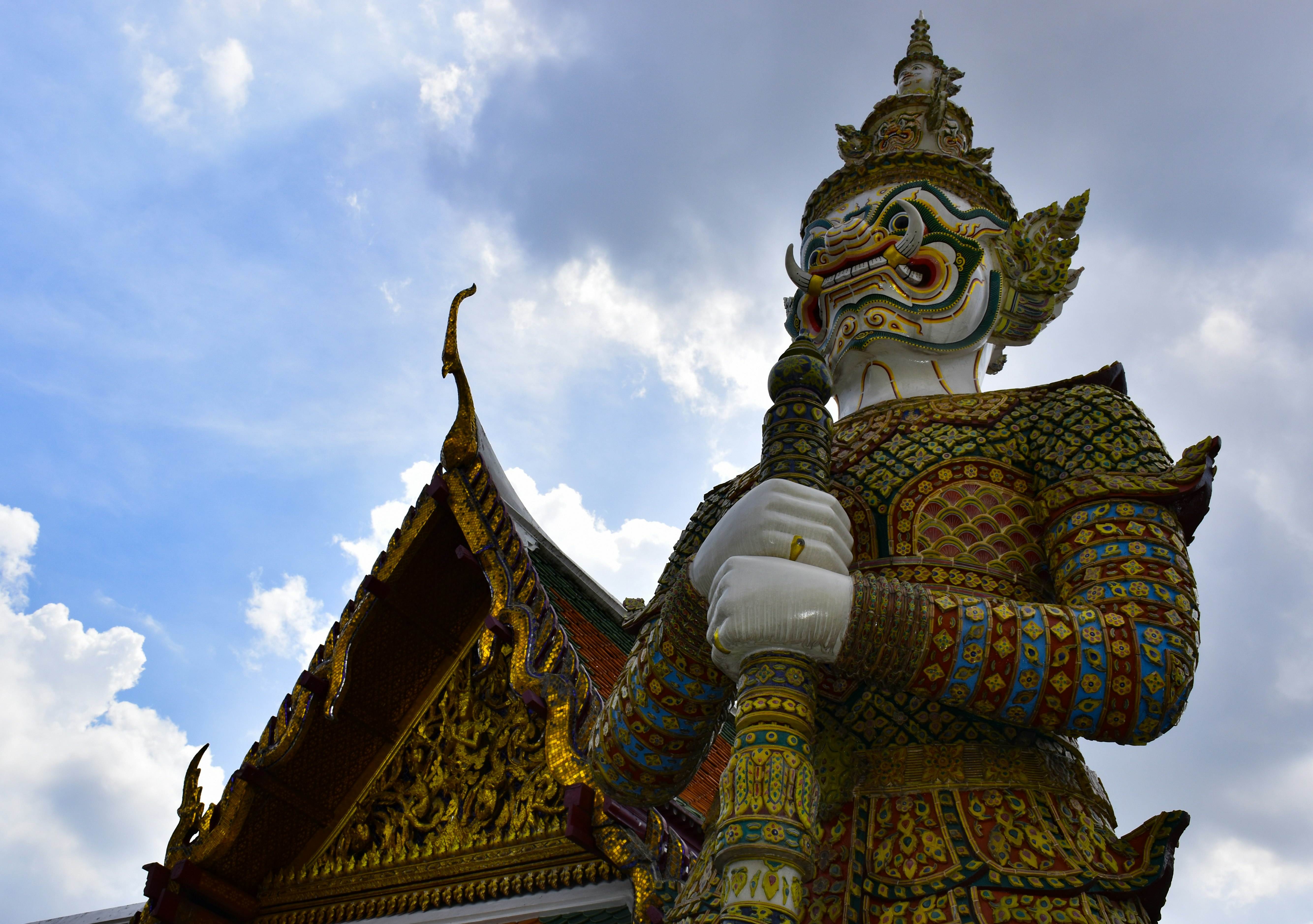Thailand traditional building and statue during daytime