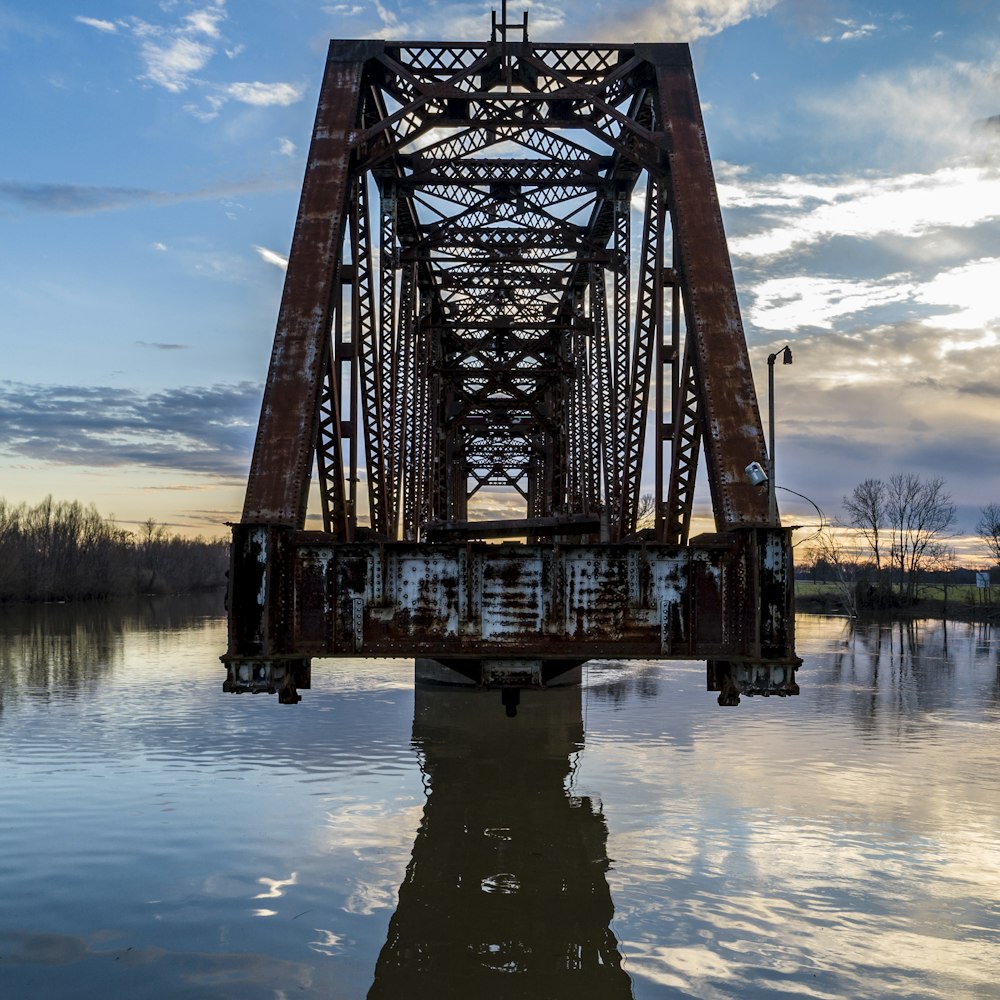 low angle metal bridge under clear blue sky