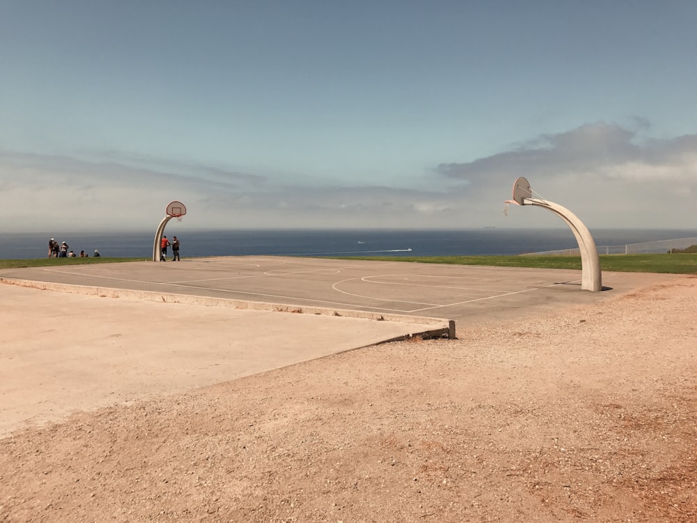 open basketball court facing body of water