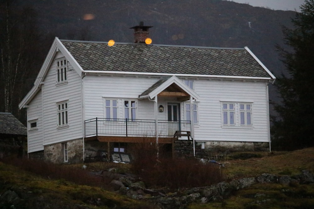 white and gray house near mountains