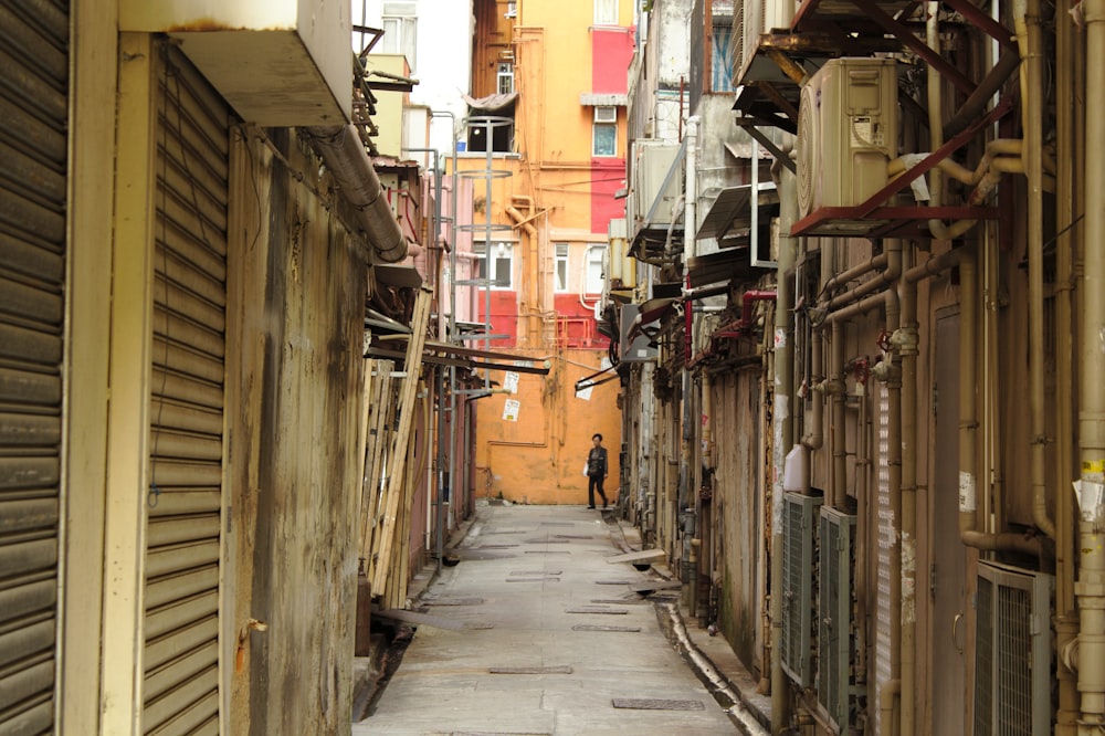 boy standing in alley