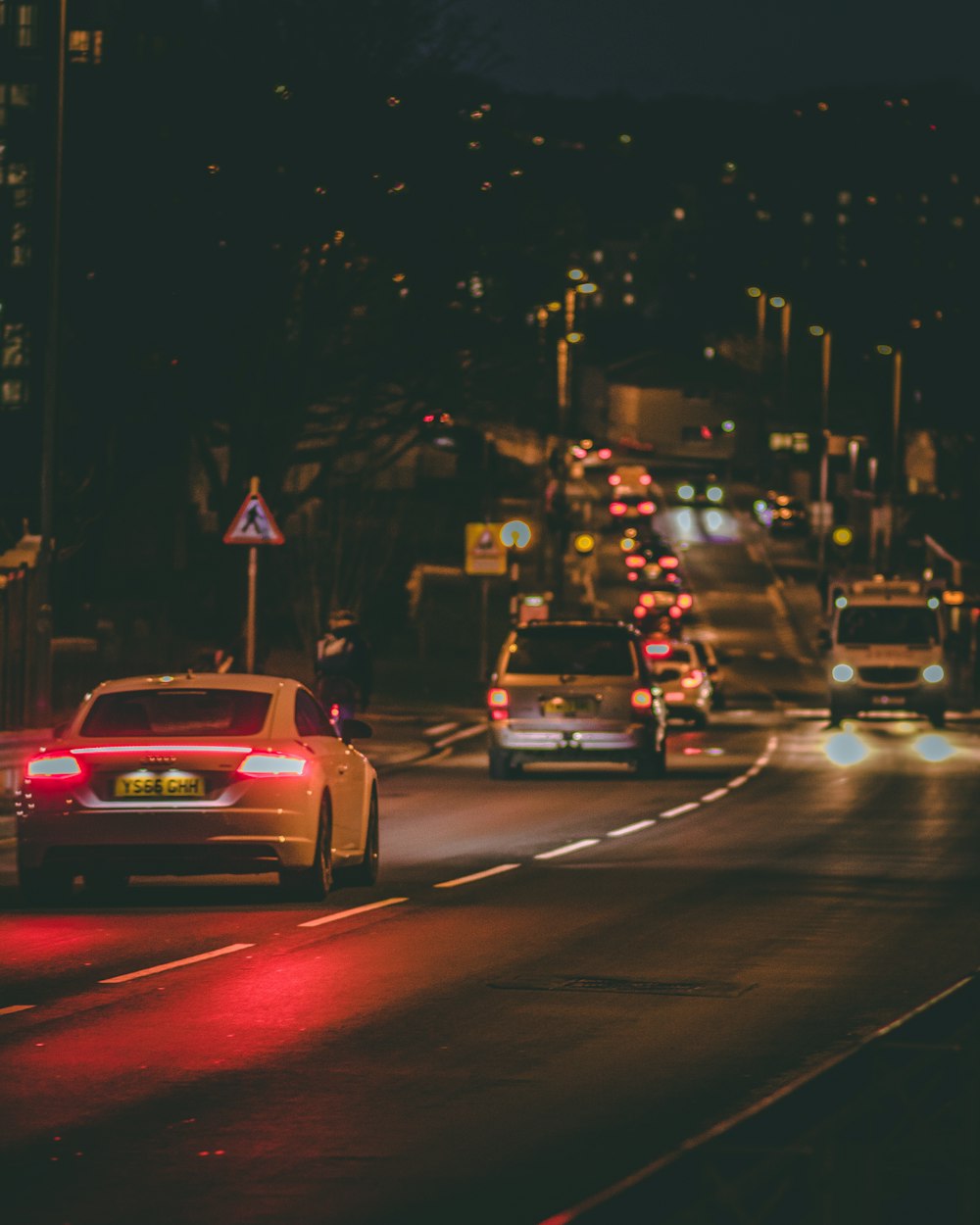 vehicles on road at night