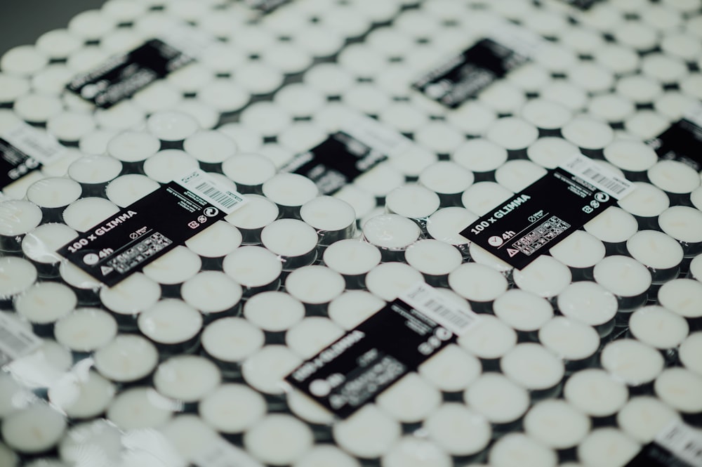 a close up of a white and black patterned table cloth