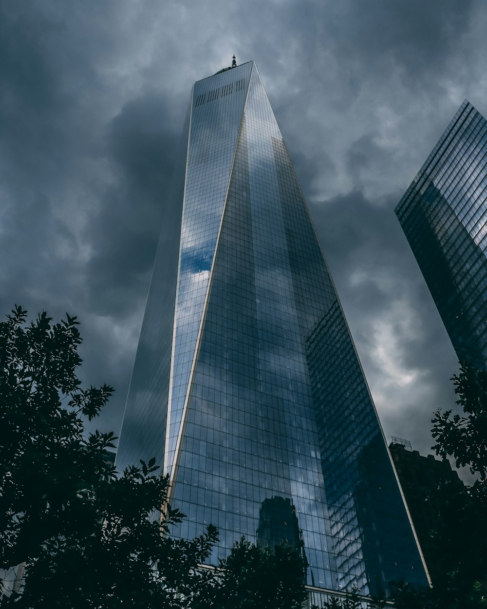 curtain wall building under cloudy sky