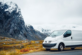 white van parked near mountain