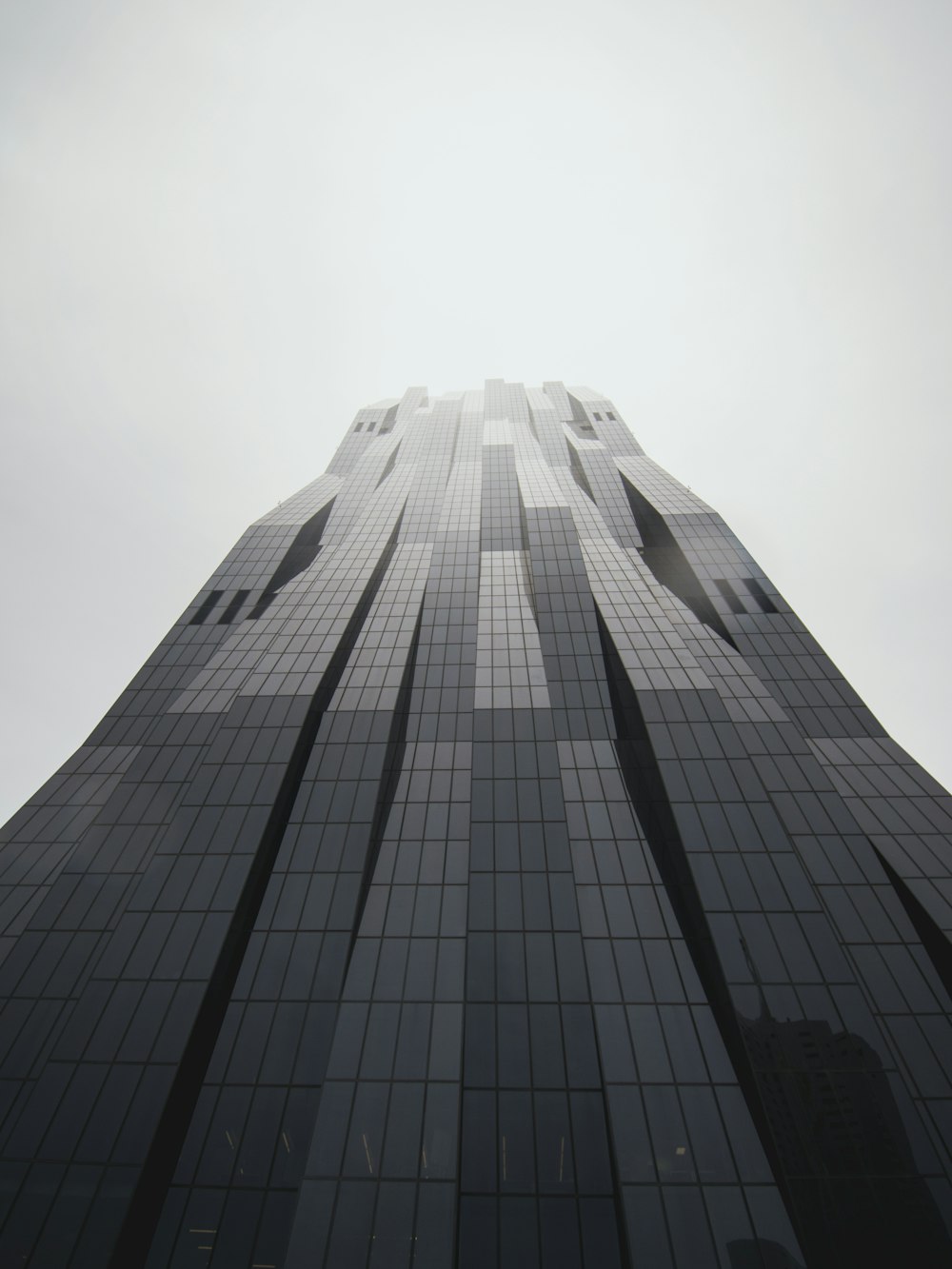 low-angle photography of black building