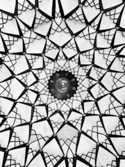 A dark, elegant design featuring sacred geometry elements.