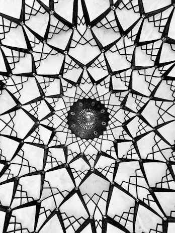 Elegant Islamic geometric pattern blending gold and emerald with a subtle glowing effect.