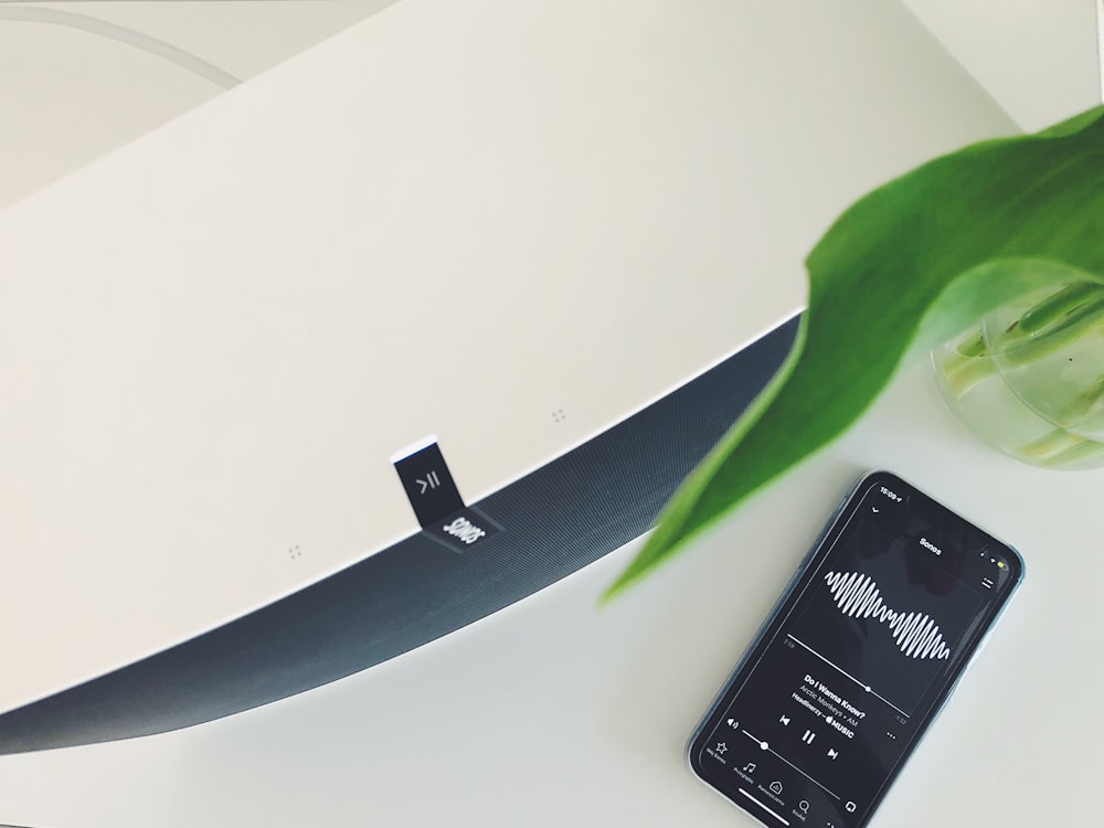 black Android smartphone on white wooden table