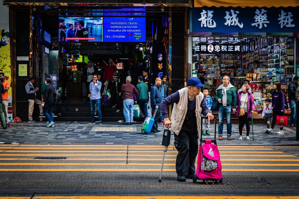 woman crossing on road during daytime