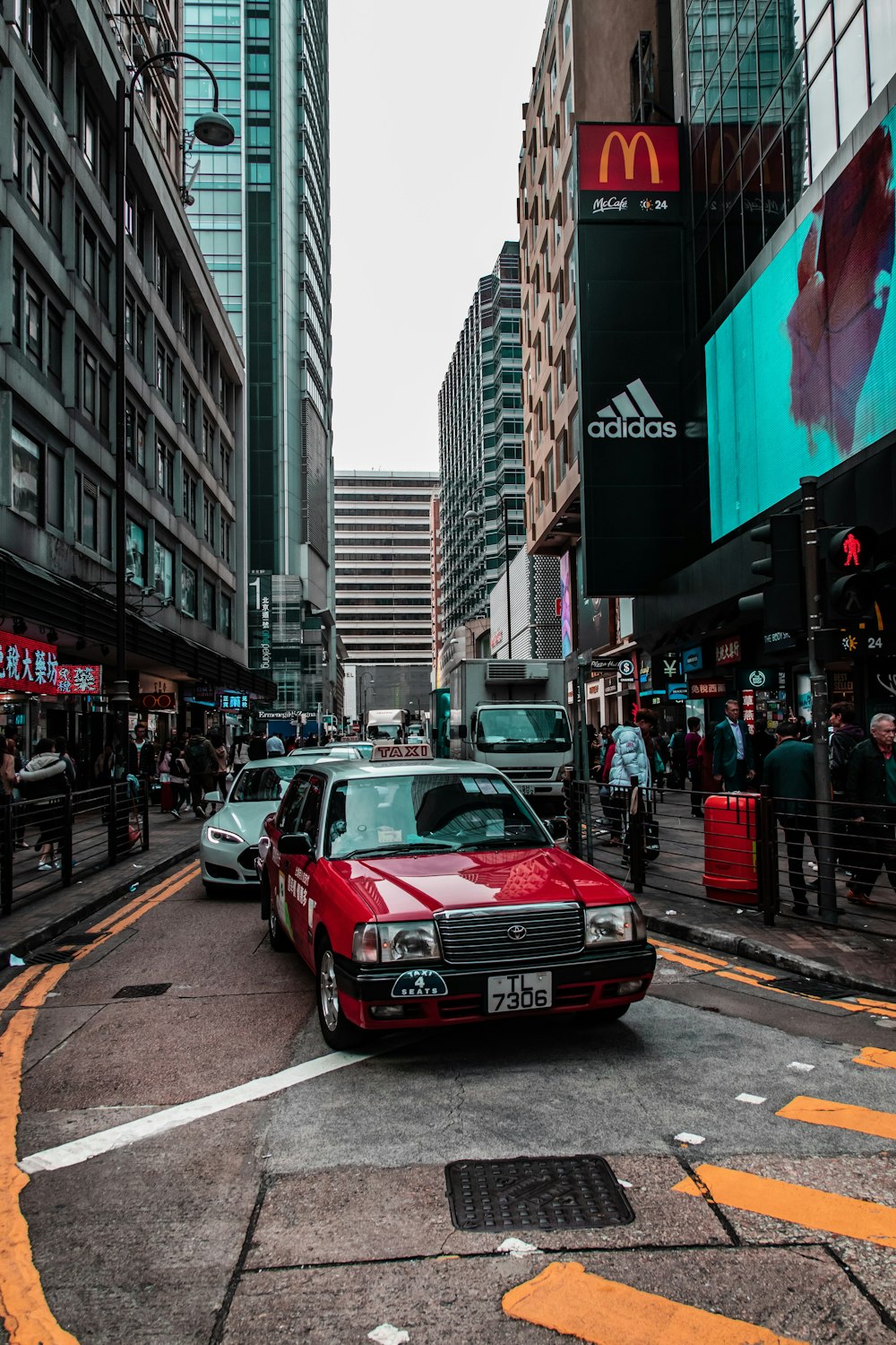 red taxicab on street