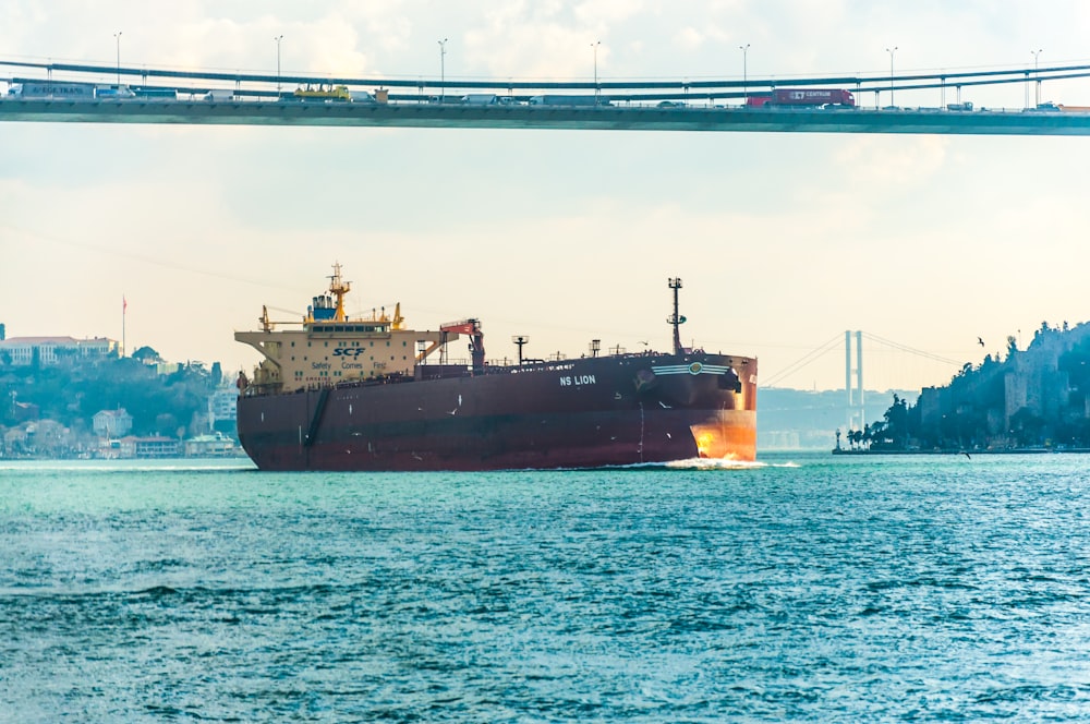 maroon ship on sea