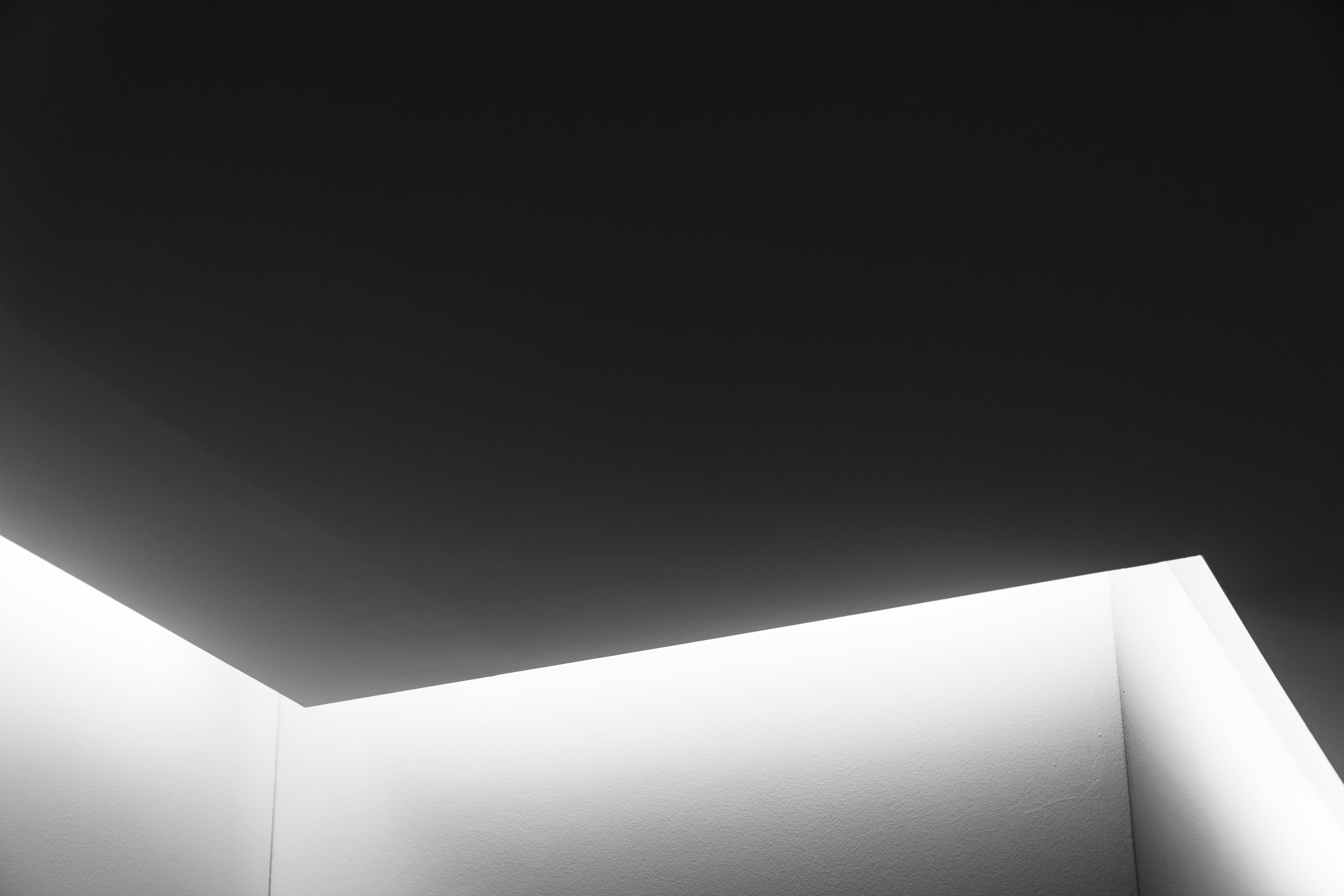 A black and white photo of a light in a room