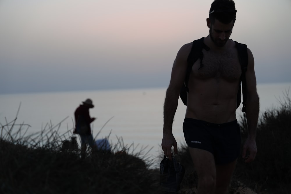 topless man walking