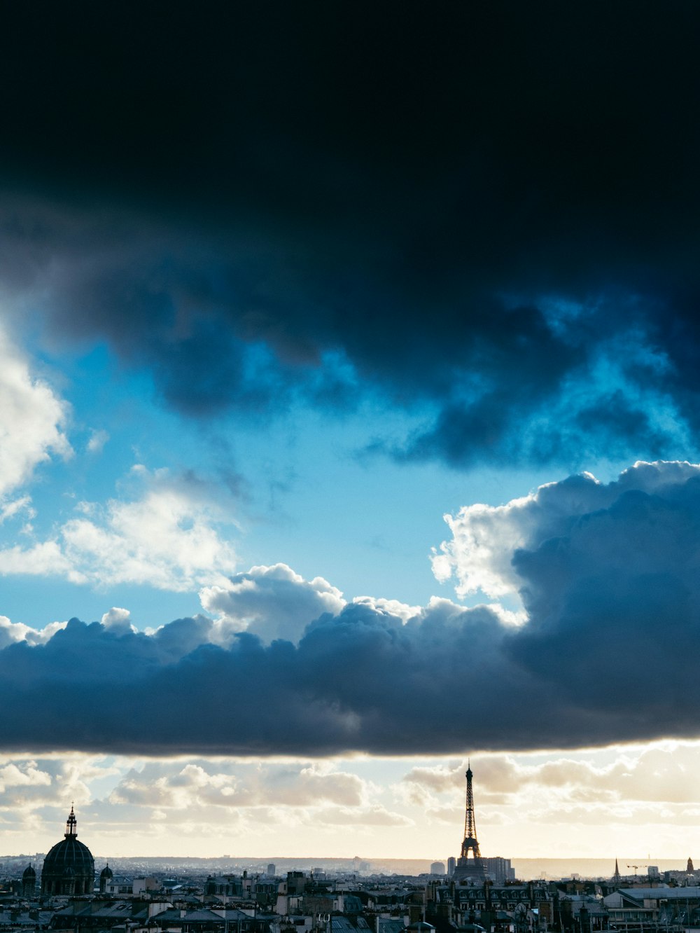 city buildings under cloudy sky