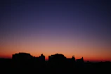 Print showcasing a continuous line-art of the Rochester skyline with a bold purple-to-orange gradient background.