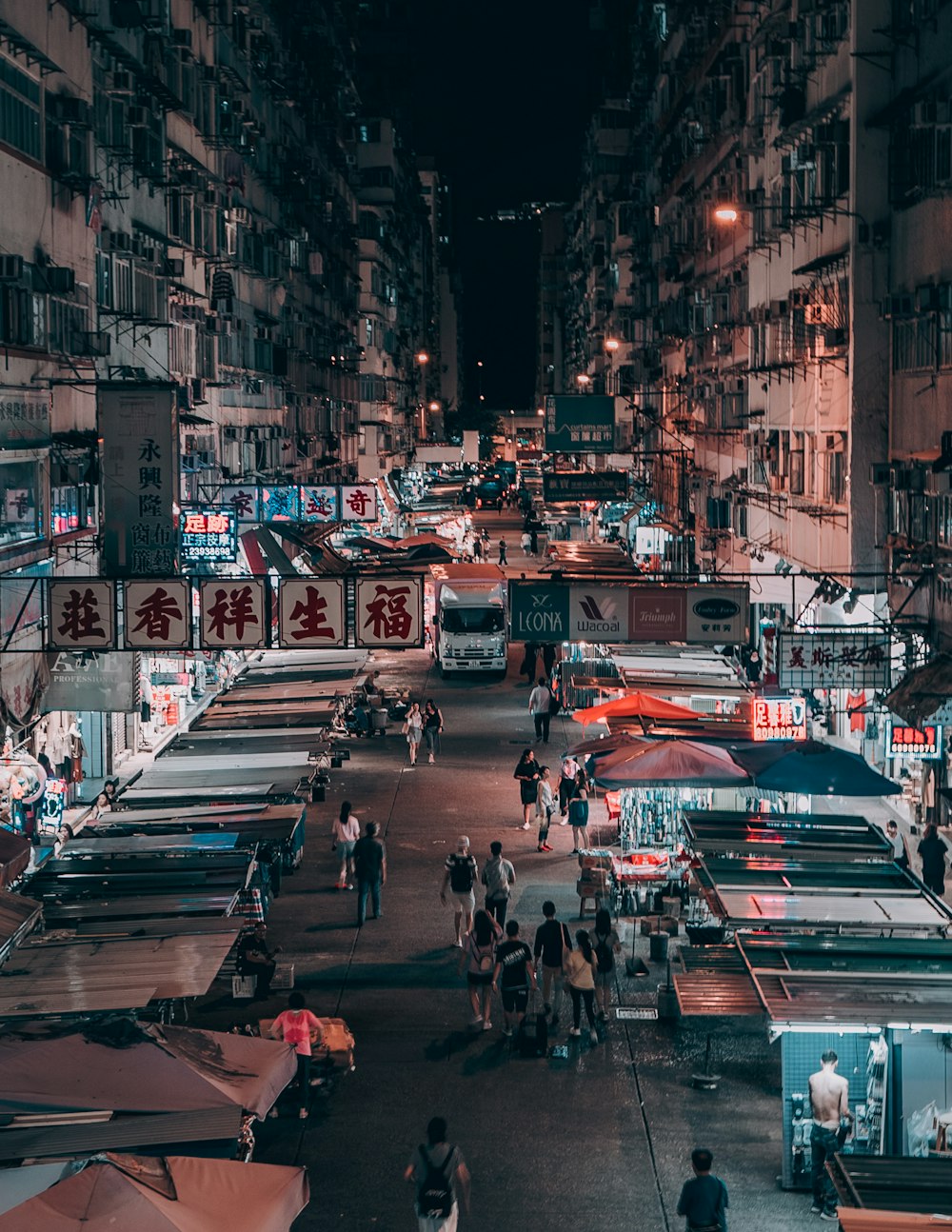 people walking on street during nighttime