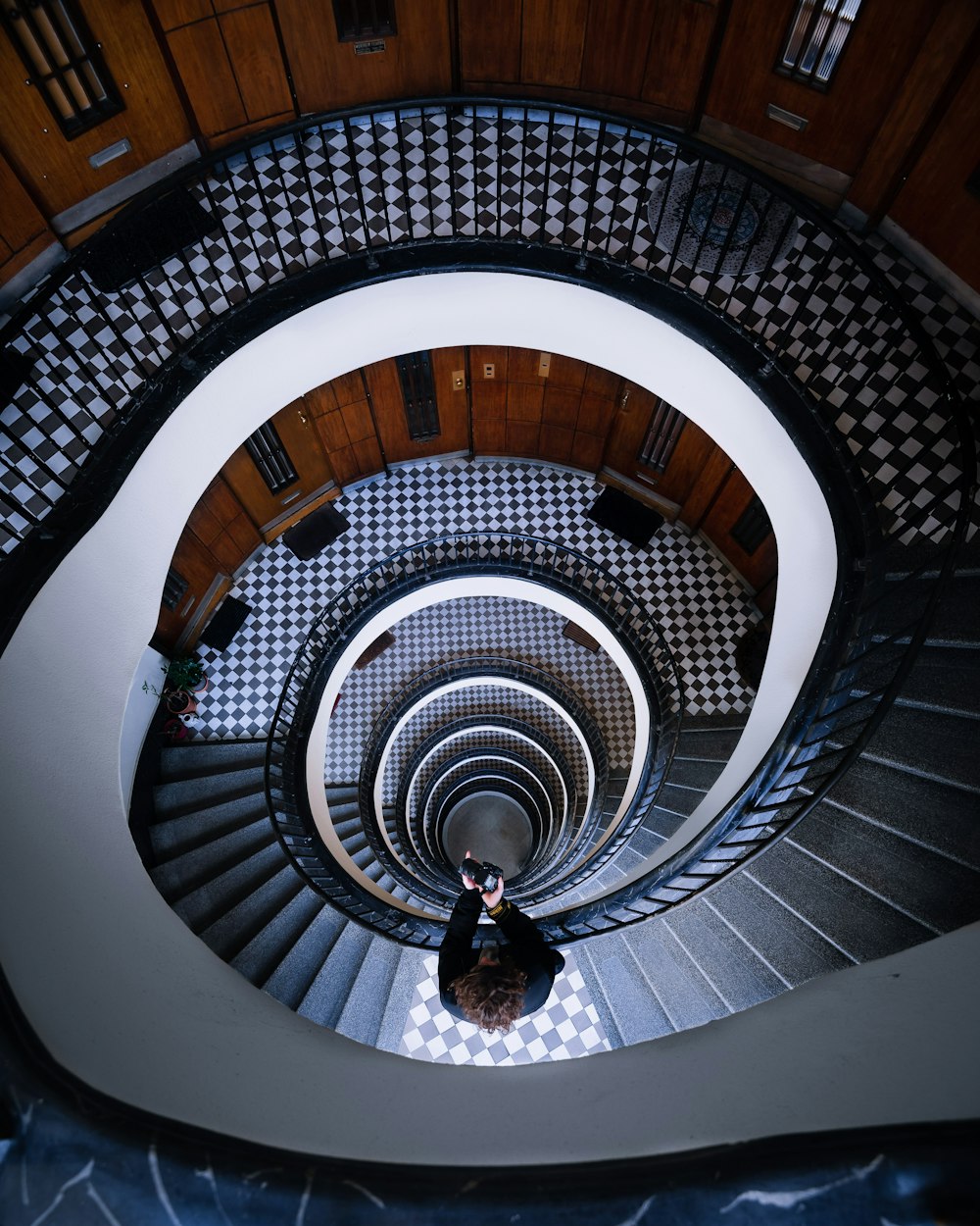 high angle photography of spiral stairs