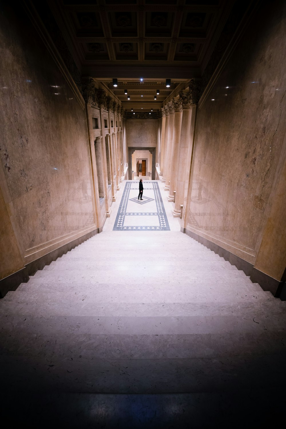 person standing beside staircase