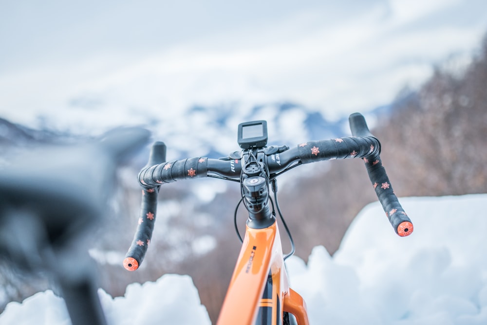 orange road bike on selective focus photography