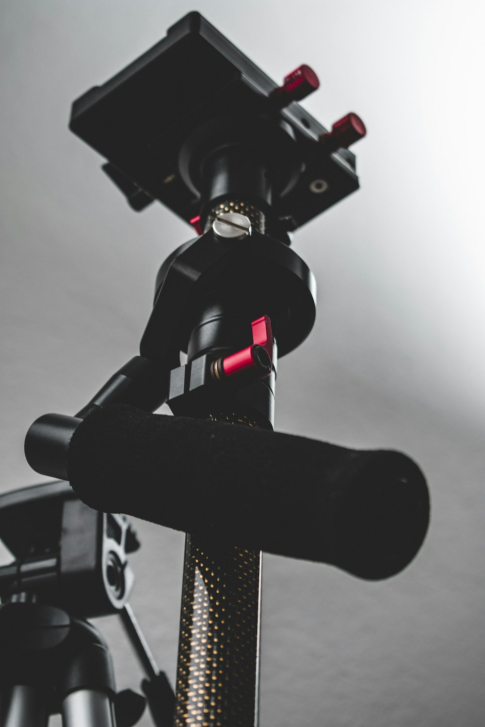 close-up photography of black camera stand