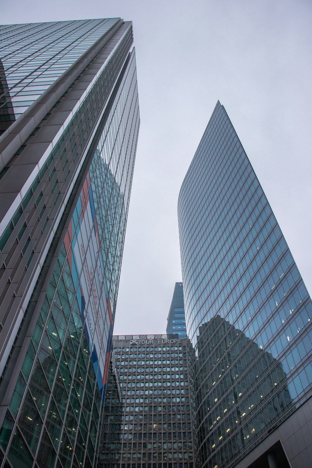curtain wall buildings under white sky